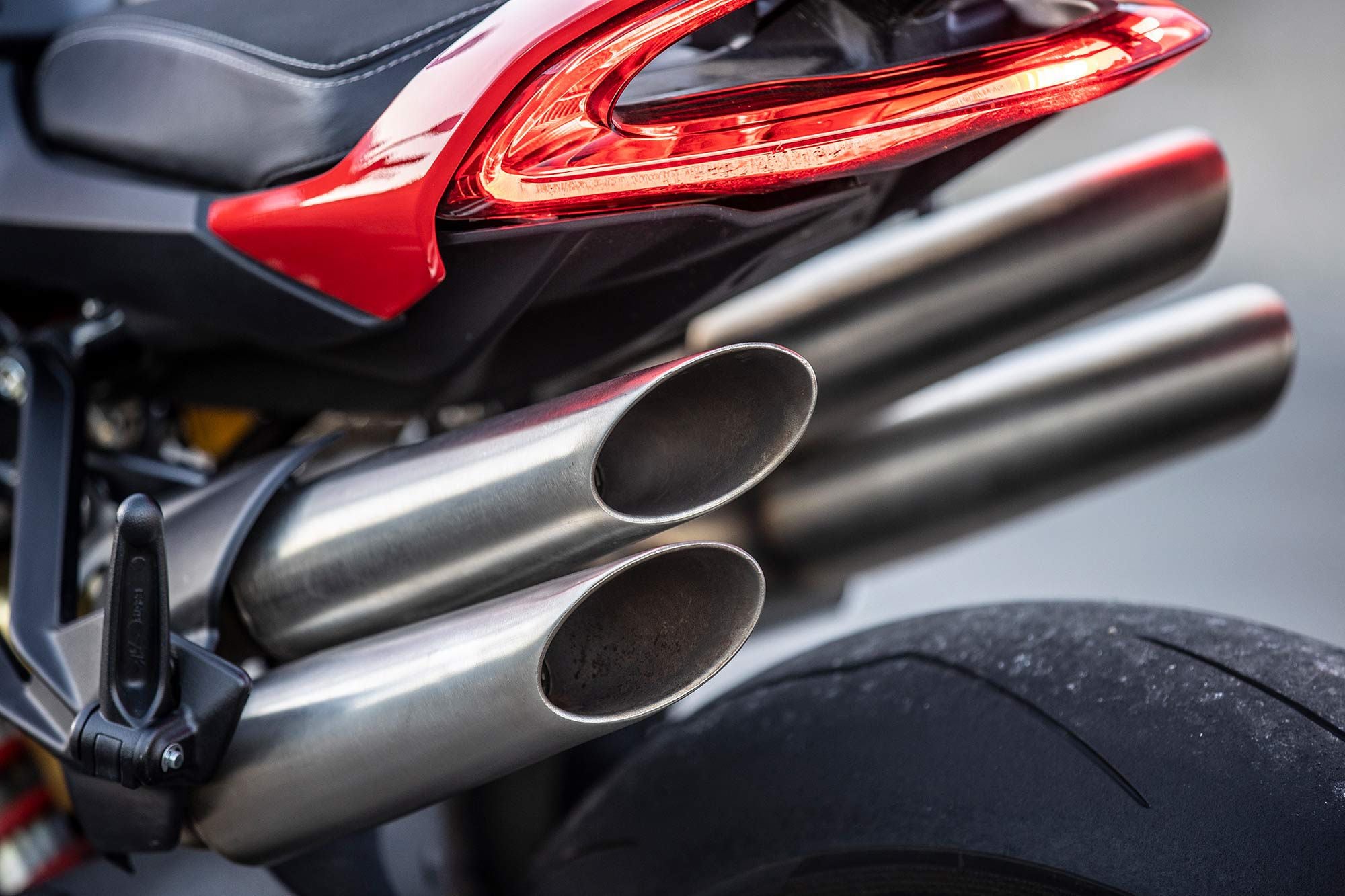 Four slash-cut exhaust tips exit under the tail.