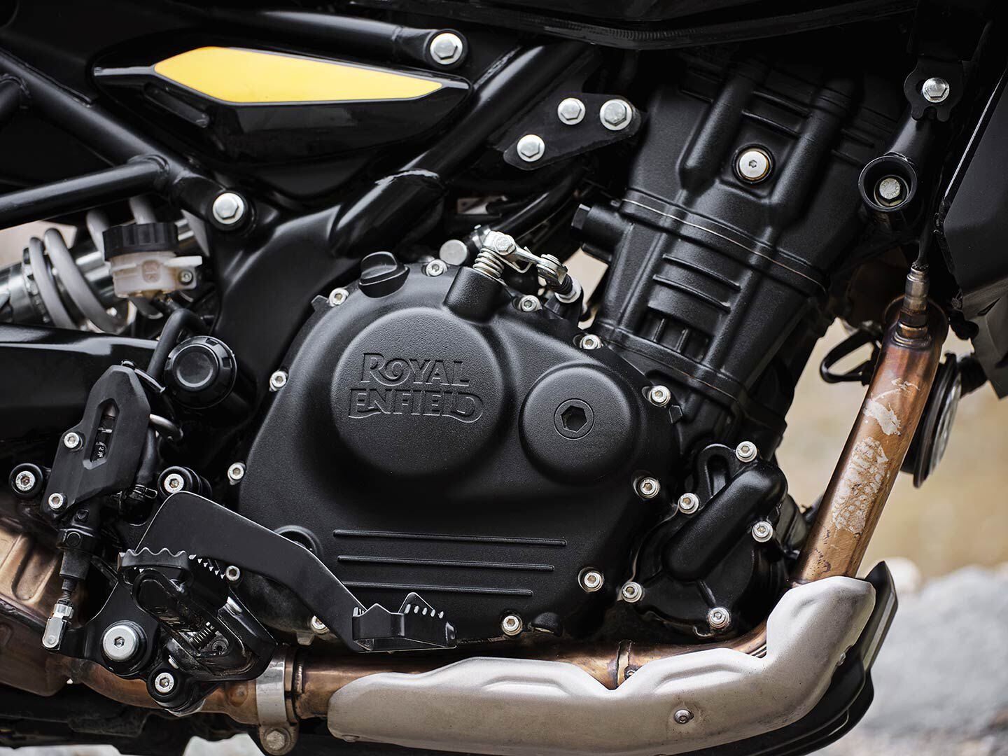 The brand-new 452cc single has four valves and a pair of overhead cams and, most importantly, liquid-cooling.