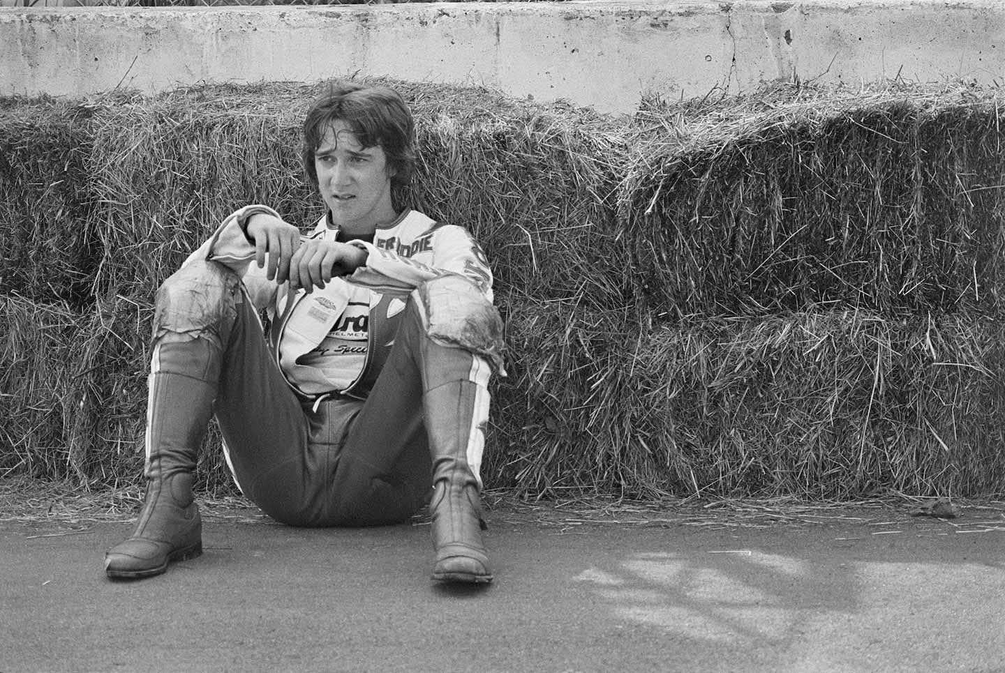 The greatest racers have tremendous memories and capacity for thought—and perhaps worry more than the rest of us as part of their drive to succeed. Here, Freddie Spencer leans against hay bales lining a concrete wall at Loudon in 1979.