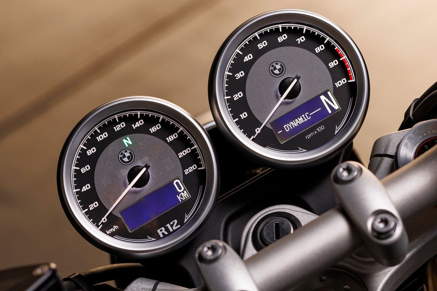 The retro theme extends to the twin gauges with a mix of analog and digital displays.