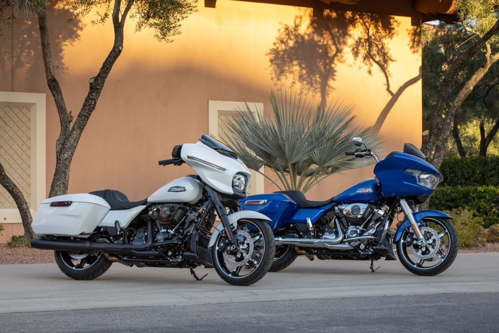 The 2024 Harley-Davidson Street Glide (left) and Road Glide (right) are mechanically very similar; the Street Glide has a fork-mounted fairing, while the Road Glide’s is frame mounted.