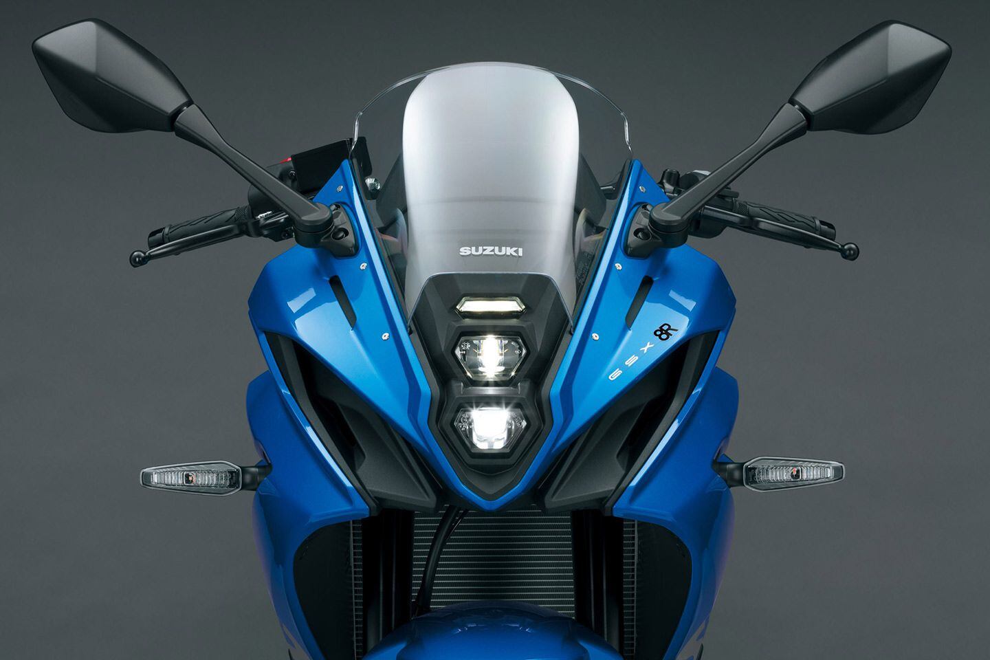 The stacked headlights conform to the rest of Suzuki’s middleweight twin family, but are mounted to the fairing instead of to the bars.