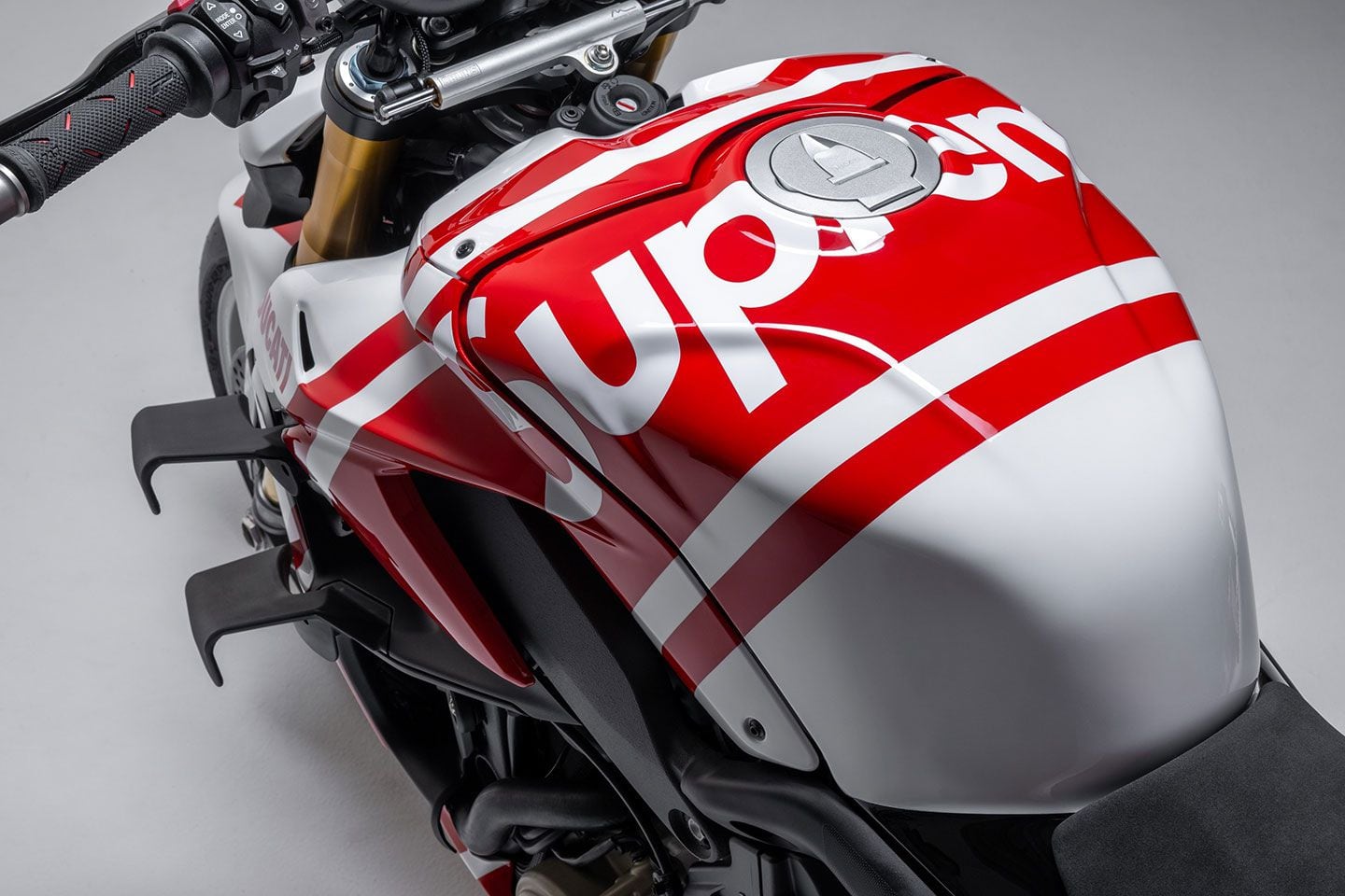 The bold white typeface of the Supreme logo across the Streetfighter’s tank sure looks familiar. Any art majors out there?