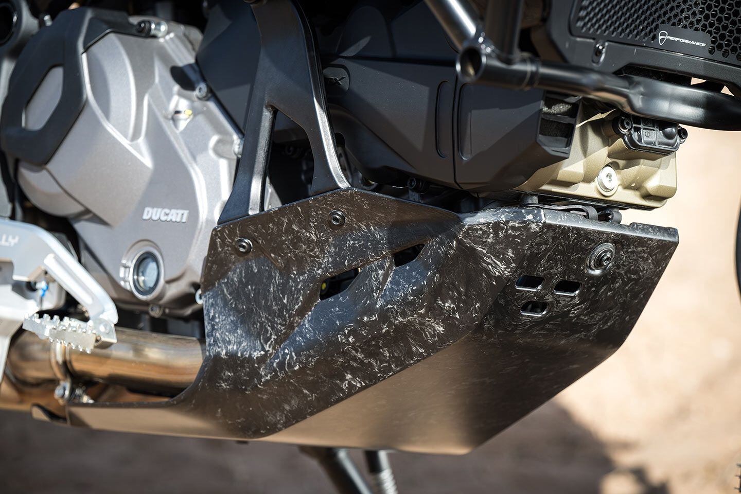 A carbon fiber skid plate is standard equipment on the DesertX Rally.