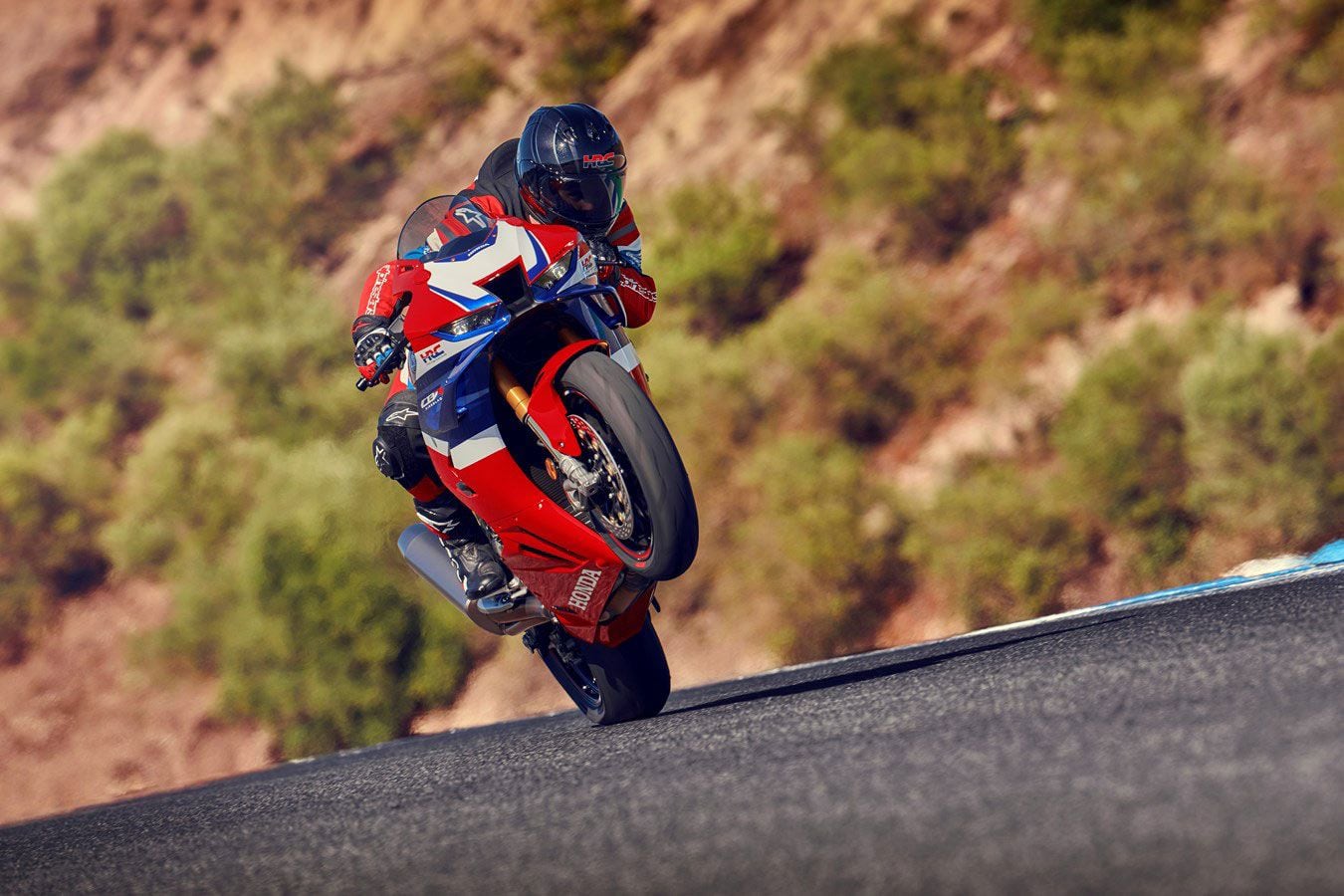 2024 Honda CBR1000RR-R SP wheelie action.