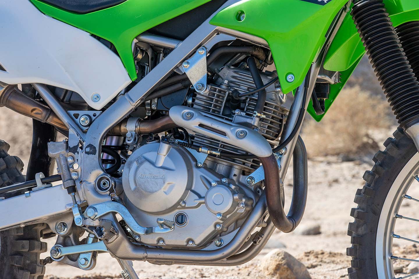 The 2022 Kawasaki KLX230R is powered by a 233cc four-stroke, air-cooled single-cylinder engine.