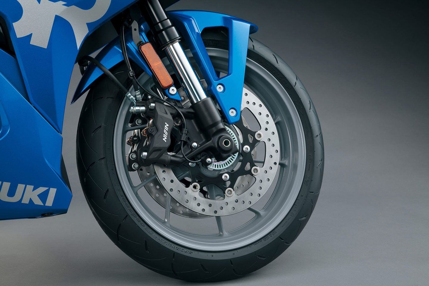 A pair of Nissin radial-mount calipers with 310mm discs are fitted up front, while a new Showa SFF-BP fork replaces the KYB units from the GSX-8S.