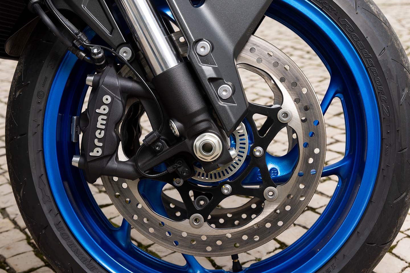 Front brakes lack initial bite and power through the pull, which leaves something to be desired on a bike that’s as capable as the GSX-S1000GX+.