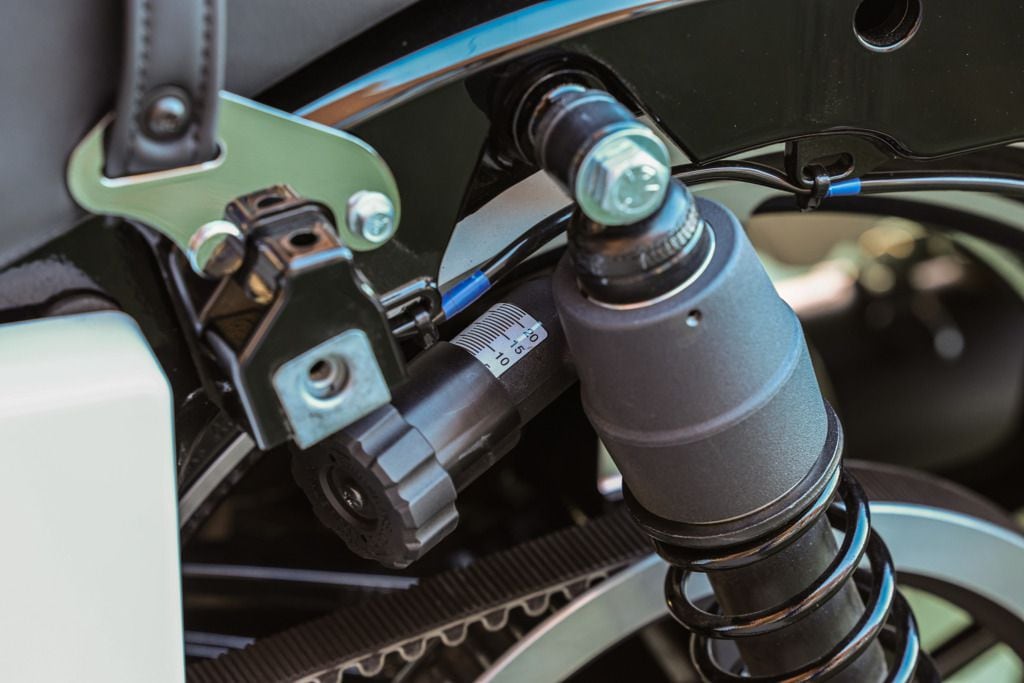 The Showa shocks on each machine have provisions for preload adjustability. Just remove the saddlebag to access the shocks.