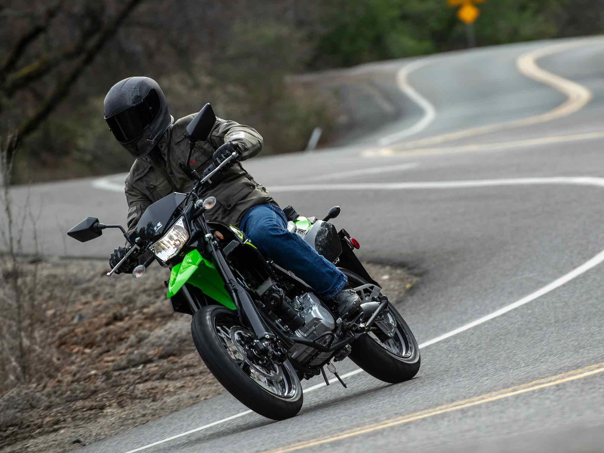 On the road the KLX300SM’s firmer springs and 17-inch wheels give more road feel and less weight transfer during acceleration and braking.