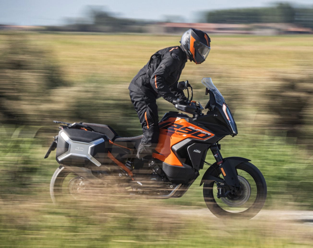 2024 KTM 1290 Super Adventure riding on country terrain