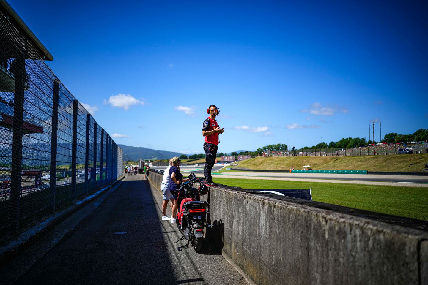 Poggiali films the action so the team can sync up the data with what the rider is doing on the track.