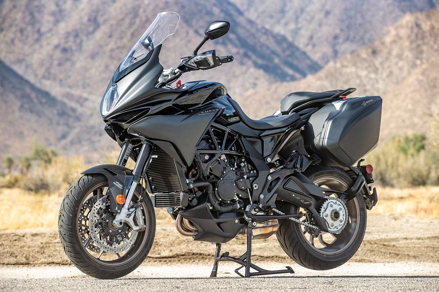 There are sporty bones behind that tall windscreen and 34-liter saddlebags. Notice the thick, but low-mounted seat, a big improvement that came as part of the 2021 model year update. Centerstand is a nice touch for a touring bike too.